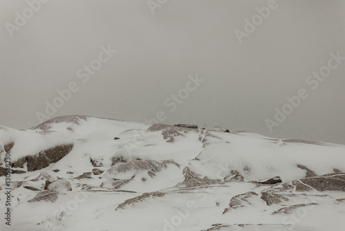 Snow-Covered Rocks and Ocean at Peggy’s Cove During Winter