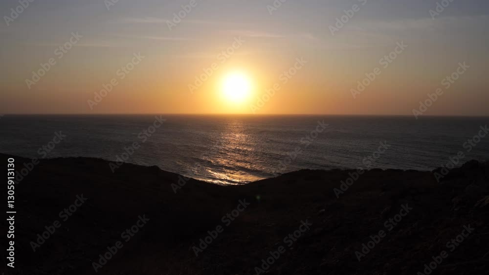 Timelapse of scenic sunset silhouette near the coastline of Colombia. Sun setting in the ocean. Timelapse of scenic sunset silhouette near the coastline of Colombia. Sun setting in the ocean.