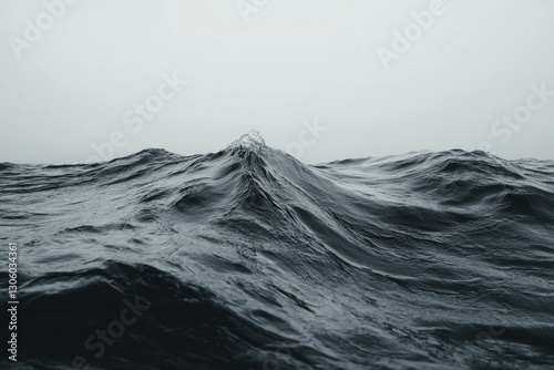 Black and white slow shutter of wave rising on ocean’s surface