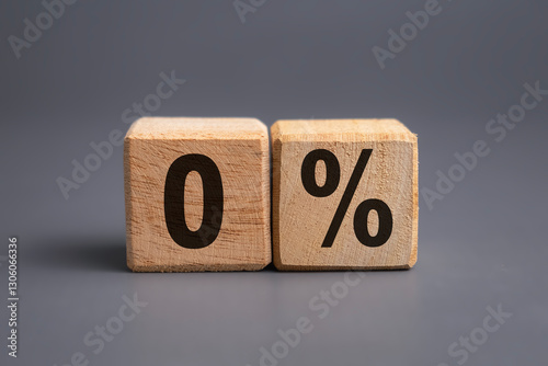 zero percent letter symbol on wooden blocks isolated on grey background. business financial concept