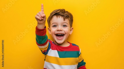 Smiling Young Child Pointing Upward With One Finger Raised