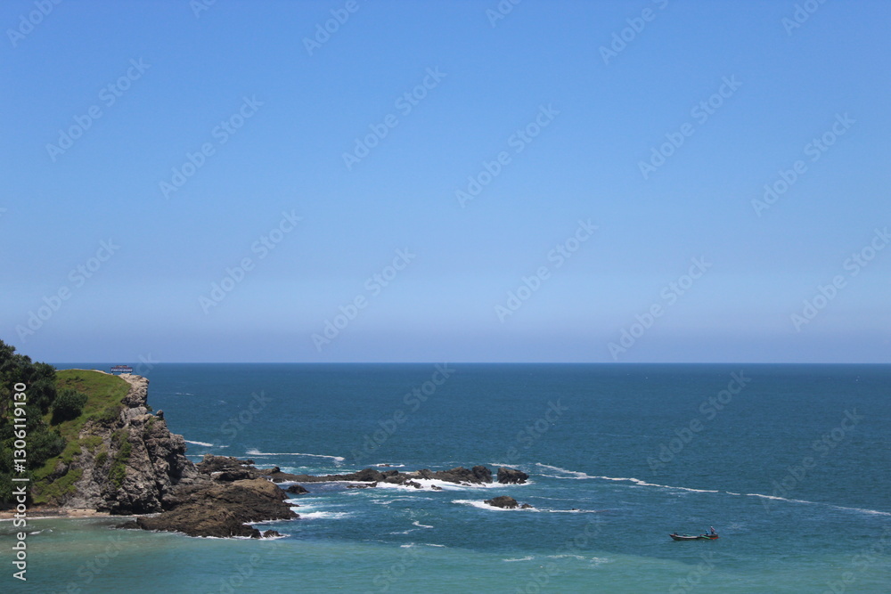 Serene Coastal Landscape with Gentle Waves and a Small Fishing Boat Serene Coastal Landscape with Gentle Waves and a Small Fishing Boat