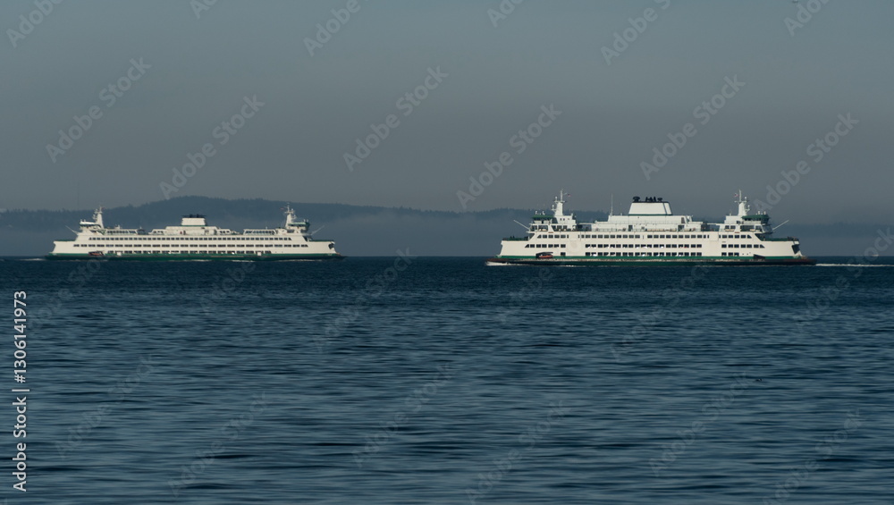 Two ferries meetup next to Bainbridge island covered by low fog Two ferries meetup next to Bainbridge island covered by low fog