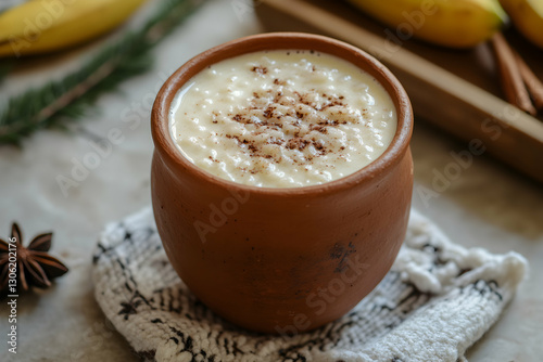Delicious Guatemalan atol de arroz served in traditional clay cup still life