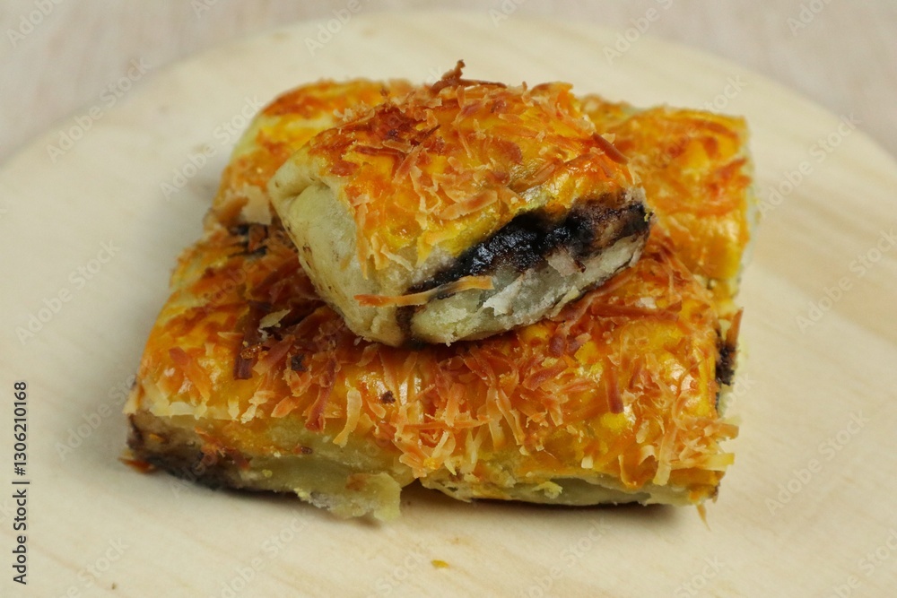 Banana Bolen Wrapped in Puff Pastry is a typical Indonesian baked bread cake with baked flour with margarine filled with chocolate and banana.