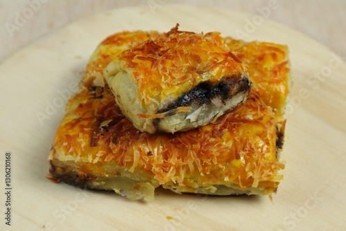 Obraz na płótnie Banana Bolen Wrapped in Puff Pastry is a typical Indonesian baked bread cake with baked flour with margarine filled with chocolate and banana. w salonie