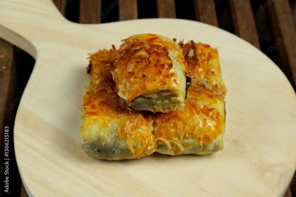 Banana Bolen Wrapped in Puff Pastry is a typical Indonesian baked bread cake with baked flour with margarine filled with chocolate and banana.