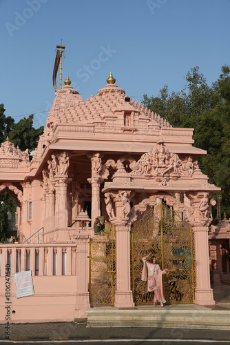 Shree Sambhavnath Shwetambar Jain Derasa, Jain temple in Ahmedabad city, Gujarat, India. Indian landmark, beautiful architecture, sight. Tourist woman, fashion girl in shalwar kameez photo