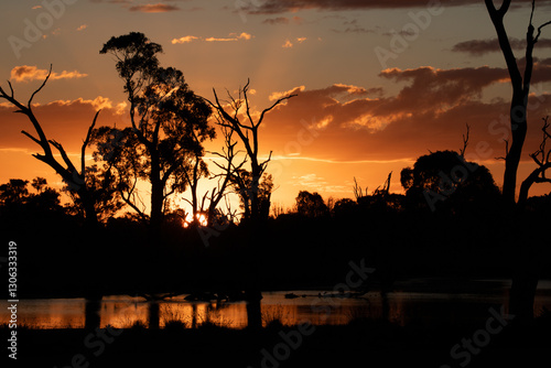 Sunset in country Victoria. Magical orange sky and reflection in the water. photo