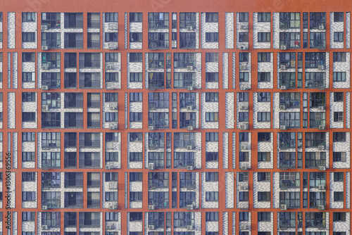 Modern apartment buildings with colorful facades and cityscape in daylight.