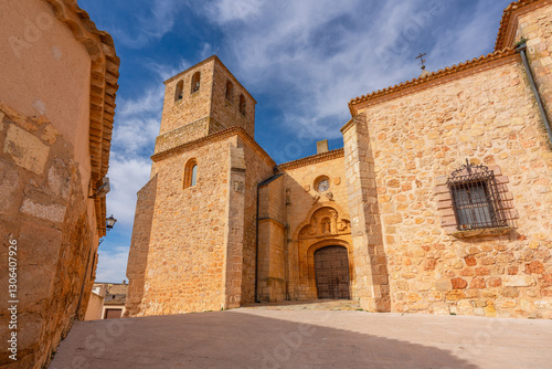 View of a  beautiful street with a church Collegiate of San Bartolomé and a bell tower in Belmonte, Castilla La Mancha, Spain