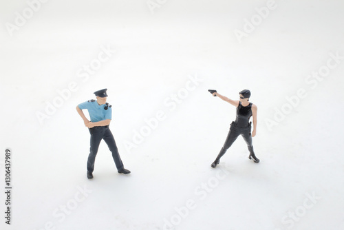 Schilderij op canvas Miniature Action Scene with Police Officer and Criminal in Confrontation
