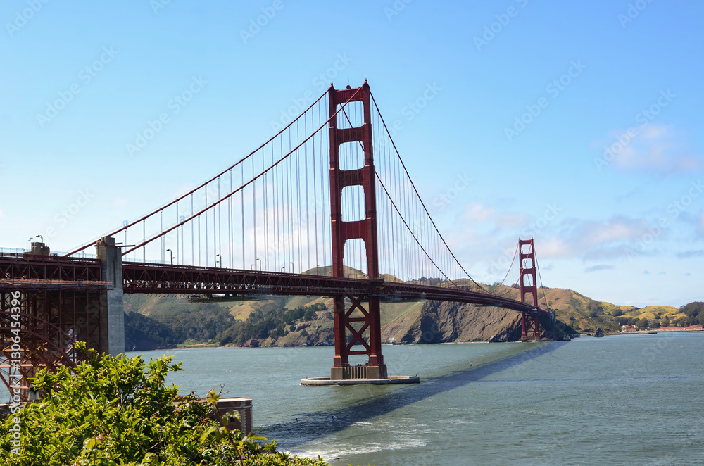 Beautiful view of famous Golden Gate Bridge with blue sky and clouds on a sunny day in summer San Francisco Bay Area California USA Beautiful view of famous Golden Gate Bridge with blue sky and clouds on a sunny day in summer San Francisco Bay Area California USA
