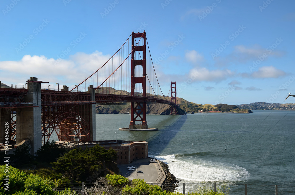 Beautiful view of famous Golden Gate Bridge with blue sky and clouds on a sunny day in summer San Francisco Bay Area California USA Beautiful view of famous Golden Gate Bridge with blue sky and clouds on a sunny day in summer San Francisco Bay Area California USA
