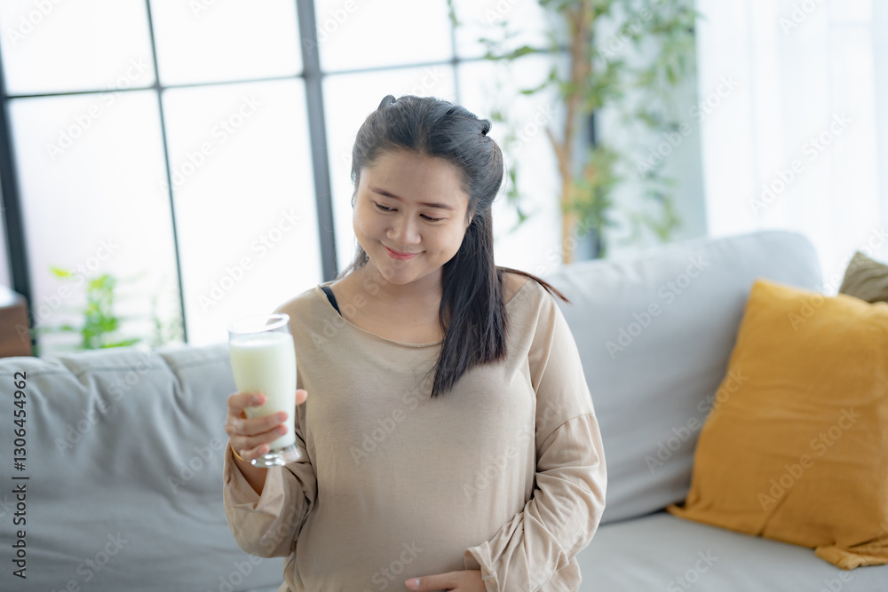 Pregnant asian woman drinking milk at home relaxation and Self-care Pregnancy drinking a glass of fresh milk mother mindfulness Positive life moment in pregnancy time Pregnant asian woman drinking milk at home relaxation and Self-care Pregnancy drinking a glass of fresh milk mother mindfulness Positive life moment in pregnancy time