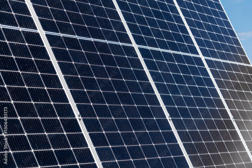 Diagonal view of bifacial solar panels at a solar energy station Diagonal view of bifacial solar panels at a solar energy station