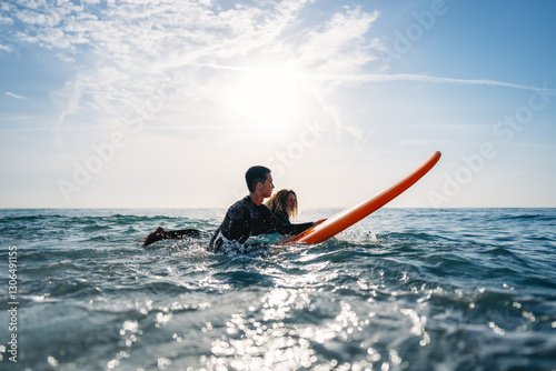 Photography Two friends surfers going for surfing in the sea