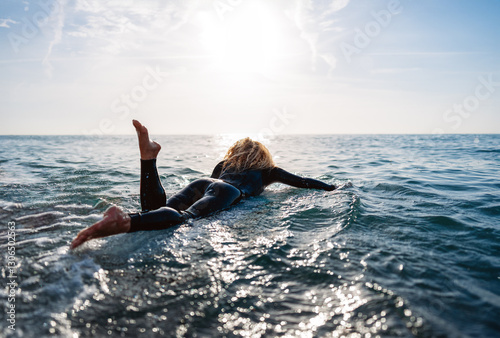 Photography Portrait of a young happy woman, surfing and enjoying summer vacation on the bea