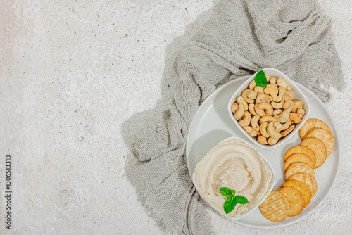 Homemade vegan cashew cheese. Raw healthy sauce in a bowl, lactose free food. Bio organic product photo