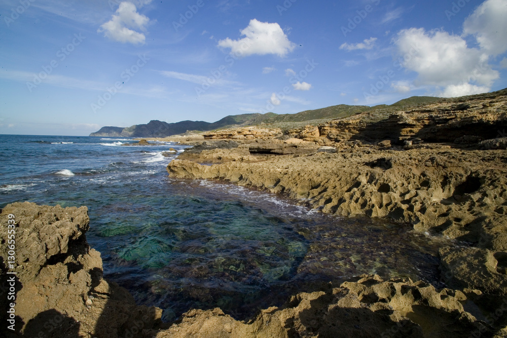 Obraz premium the roxky coast of Argentiera Porto Palmas- La Frana. Sassari, Sardinia, Italy