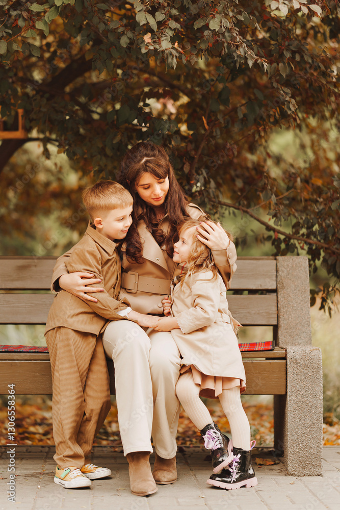 Family bond during autumn in a park on a sunny afternoon