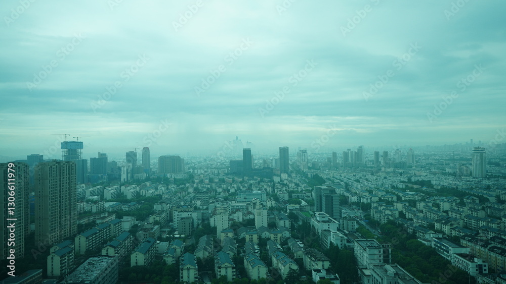 Obraz premium The panoramic city view in the rainy and cloudy day