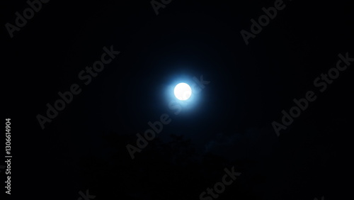 The moon view with the cloudy sky as background at night
