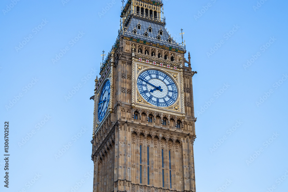 Iconic Big Ben Clock Tower Against a Clear Blue Sky in London, United Kingdom Iconic Big Ben Clock Tower Against a Clear Blue Sky in London, United Kingdom