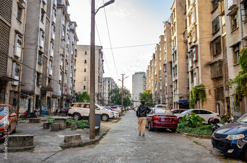 Schilderij op canvas Old, weathered apartment blocks show signs of age and wear in a run-down, low-income neighborhood in Liuzhou, China