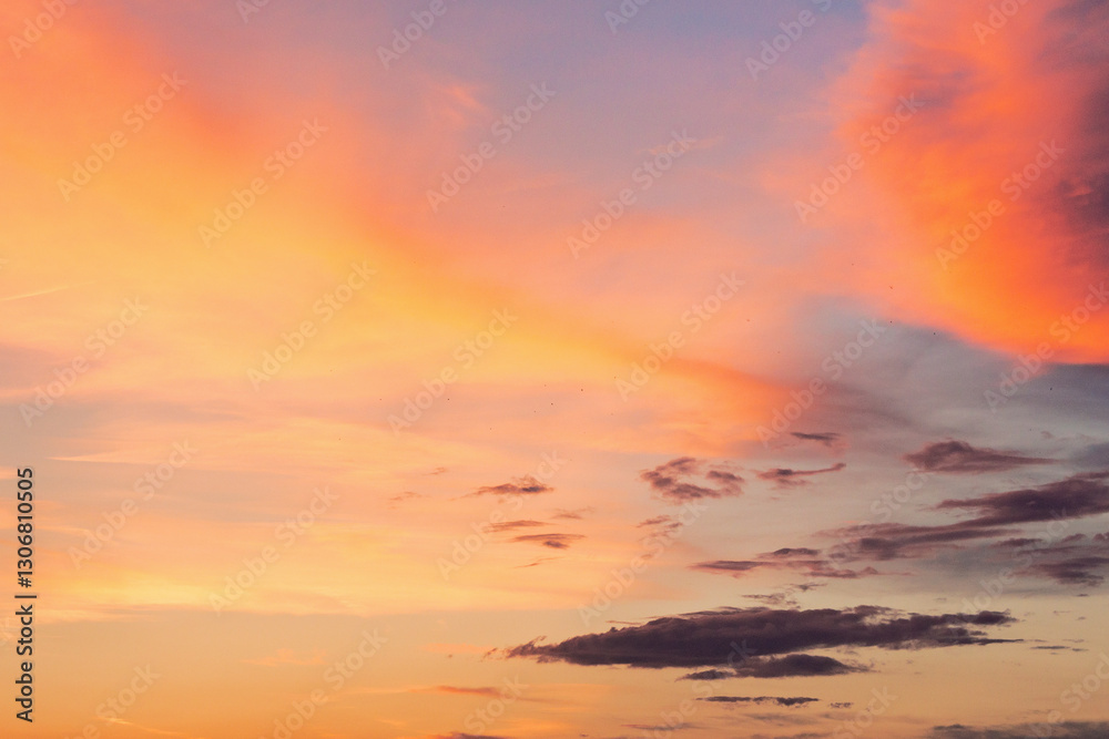 changing weather forecast. sunny heaven. red clouds on the bue evening sky. dramatic sunset background. moody springtime