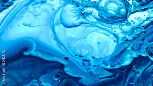 A mesmerizing close-up of a boiling liquid with dynamic swirling patterns, rich blue tones, and intricate bubbles forming, resembling a chemical reaction in motion.