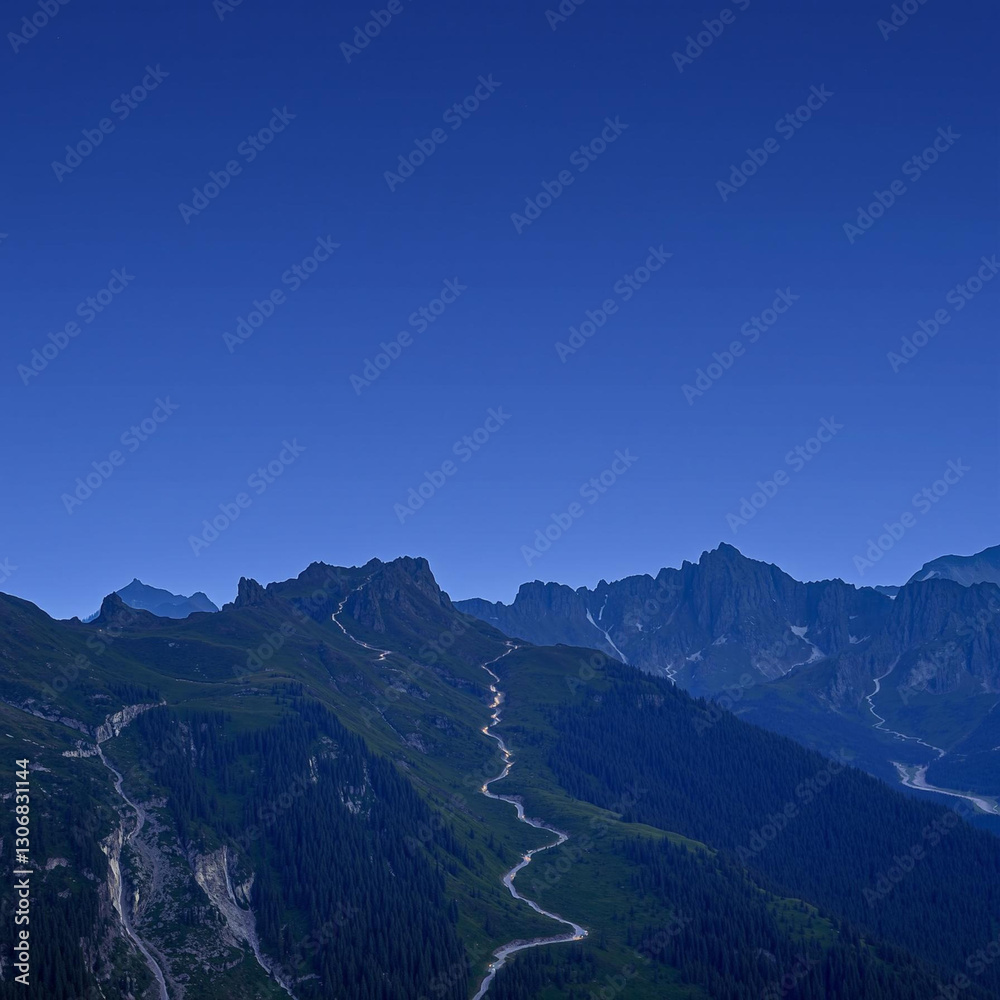 Obraz premium Serene Mountain Road Under Clear Blue Sky