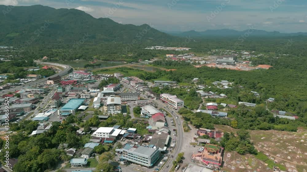Aerial Drone View, Serian District Town ,Summer With Beautiful Green Trees,New Building And Water Park Lake, Water From The Mountain Sarawak,Borneo. Aerial Drone View, Serian District Town ,Summer With Beautiful Green Trees,New Building And Water Park Lake, Water From The Mountain Sarawak,Borneo.