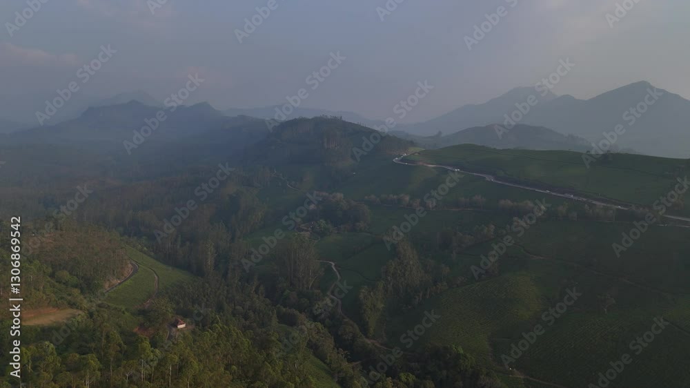 Kerala India travel background - road in green tea plantations in mountains in Munnar, Kerala, India Kerala India travel background - road in green tea plantations in mountains in Munnar, Kerala, India