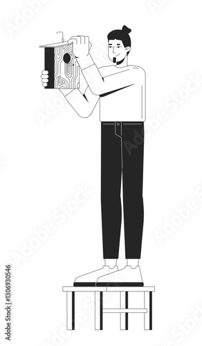 Caucasian man installing wooden birdhouse 2D line character. DIY projects, wildlife conservation, home for birds. Male woodworker isolated vector ink outline person. Monochromatic spot illustration