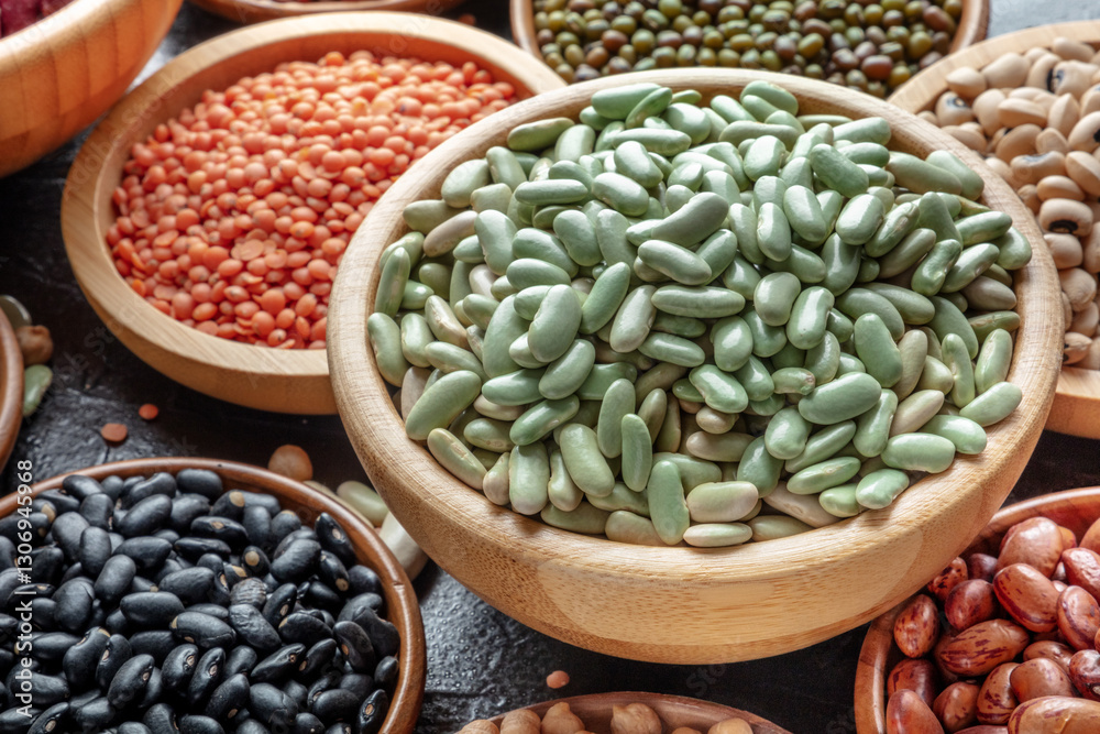 Fototapeta premium Various legumes in wooden bowls. Organic pulses. Healthy plant-based diet, vegan food