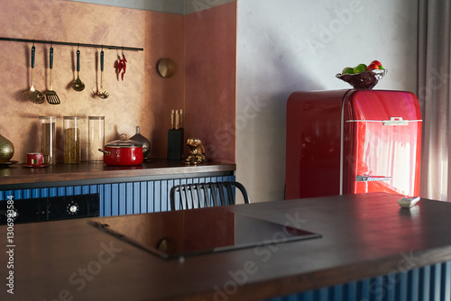 A blue kitchen with a red refrigerator and classic kitchen cabinets, a countertop in a country house. With space to copy. High quality photo