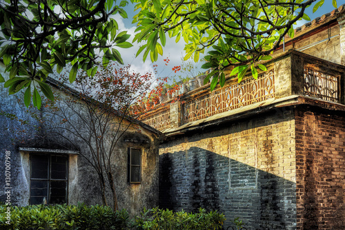 Foshan city, Guangdong, China. Nanhai Shishan Huangxi Village with a history of 800 years preserves various types of ancient buildings in the Lingnan style, traditional wood and brick carving. photo