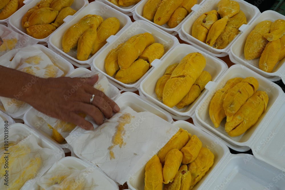 Fresh yllow durian fruit cut open in Singapore