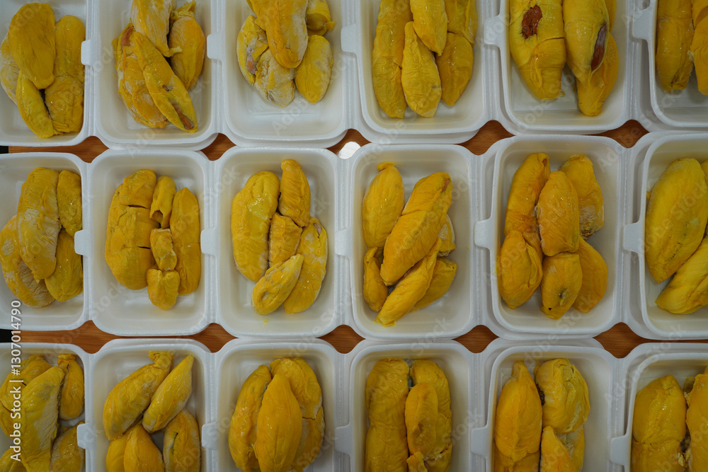 Fresh yllow durian fruit cut open in Singapore