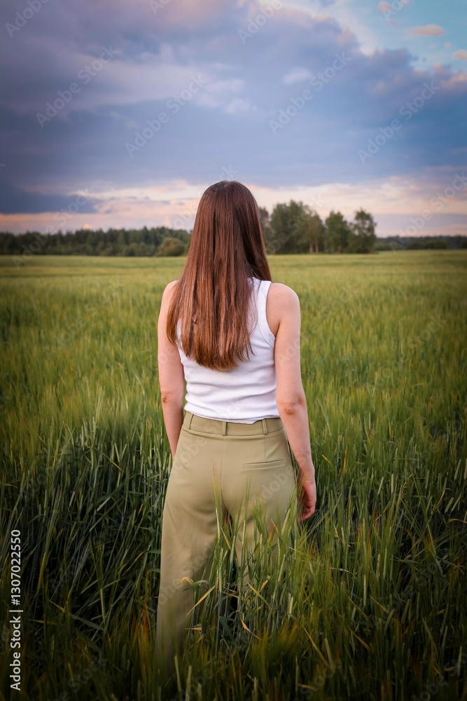 Beautiful girl in the field. Spring/Summer photo. Summer style, shades of clothes match the color of the environment. Beautiful girl in the field. Spring/Summer photo. Summer style, shades of clothes match the color of the environment.