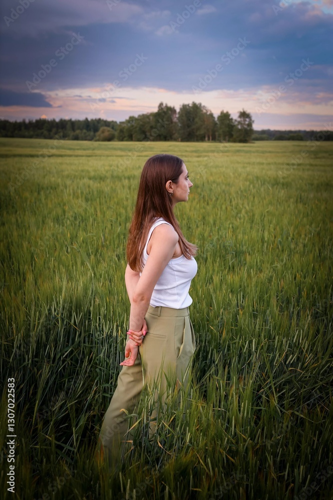 Beautiful girl in the field. Spring/Summer photo. Summer style, shades of clothes match the color of the environment. Beautiful girl in the field. Spring/Summer photo. Summer style, shades of clothes match the color of the environment.
