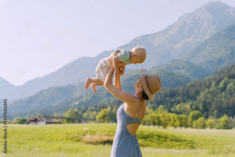 Mother and her child playing in nature. Happy healthy family. Positive emotions. Mother and her child playing in nature. Happy healthy family. Positive emotions.