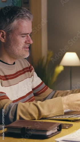 Desperate man checking bills and expenses