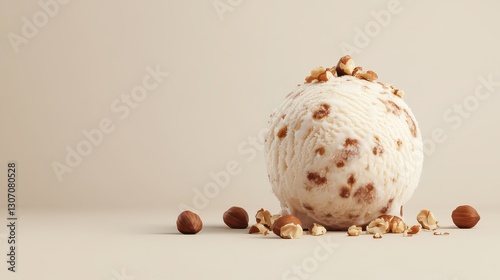 A creamy scoop of hazelnut ice cream, topped with whole hazelnuts, placed on a solid pastel beige background for a refined look.