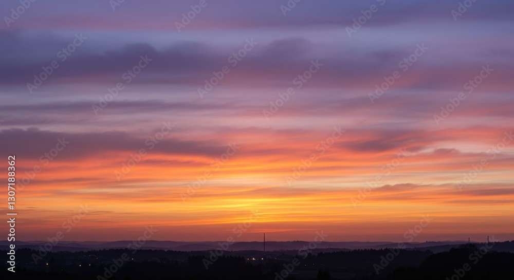 Fototapeta premium Breathtaking sunset over rolling hills with vibrant colors and serene landscape