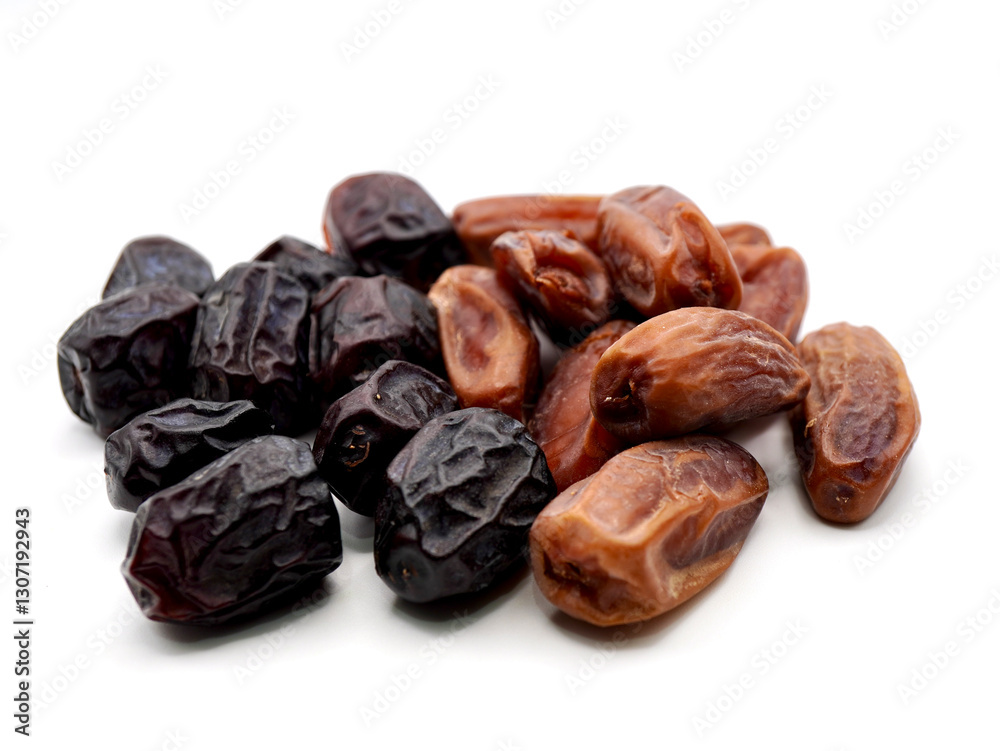Tunisian dates and Ajwa dates isolated on a clean white background Tunisian dates and Ajwa dates isolated on a clean white background