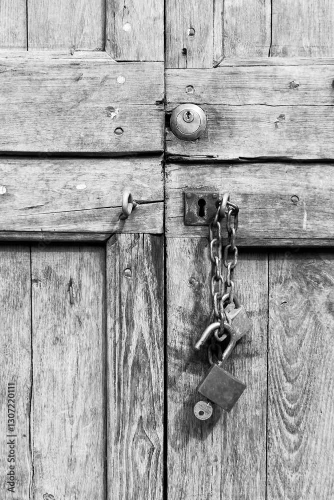 old wooden door with lock in black and white