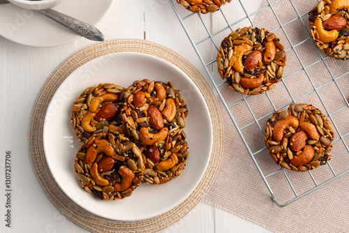 Wallpaper Mural whole grain cookies no flour no sugar in a plate.Mixed nuts, Almonds, Cashews, Peanuts, Raisins, sesame, sunflower, watermelon seed with honey cookie.Top view. Torontodigital.ca