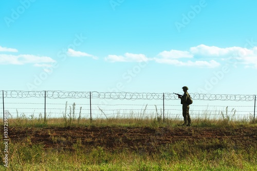 Border soldier patrolling tense frontier line